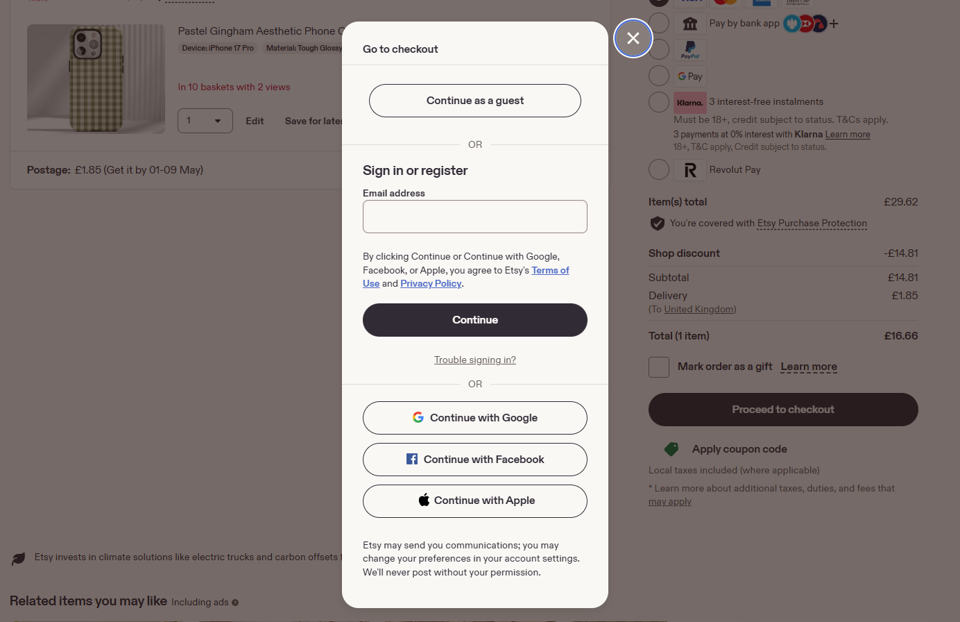 Etsy checkout modal offering guest checkout or sign-in with email and social login options.